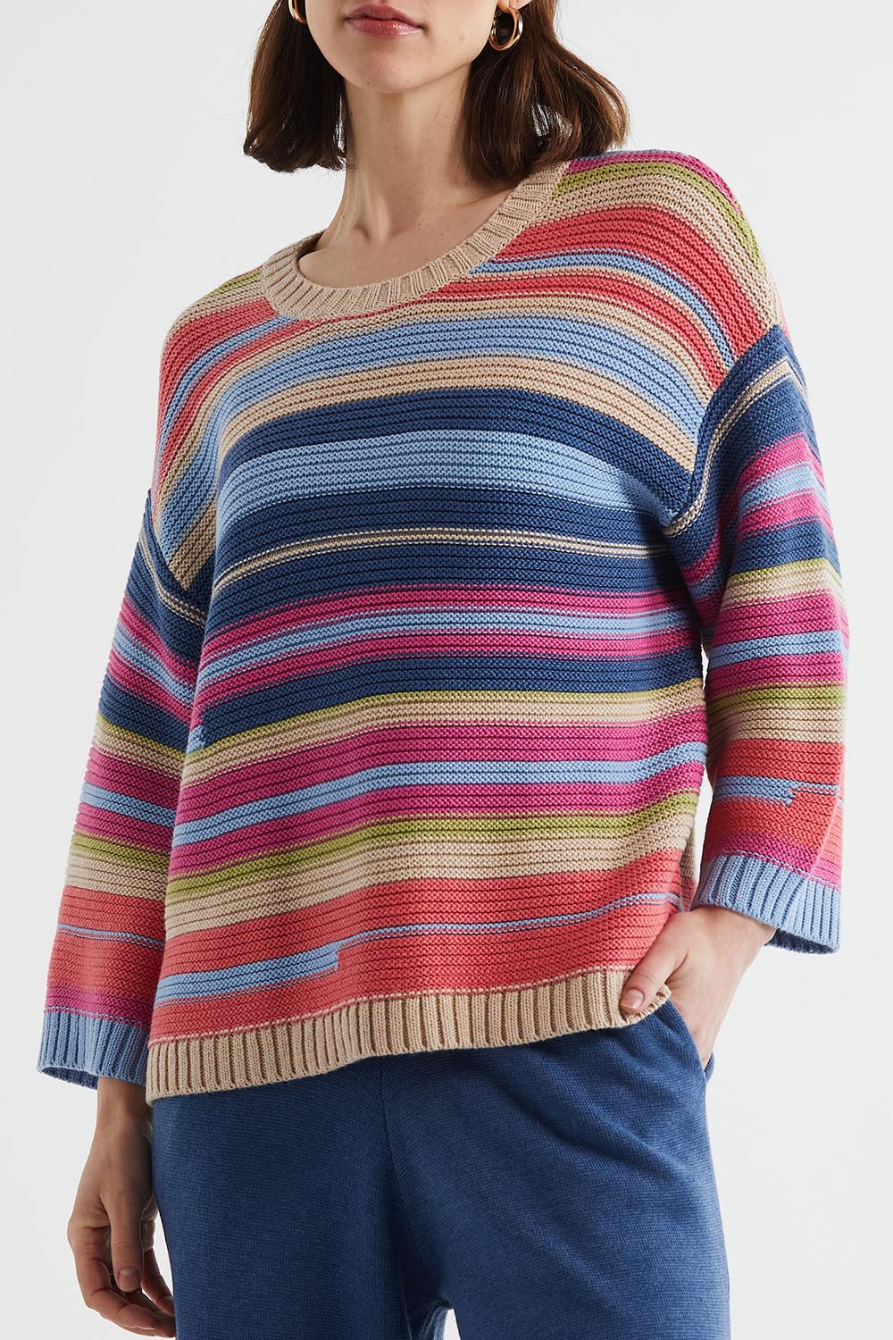 A model wearing the Multi Stripe Cotton Blend Jumper in colour Oat, from the front, cropped image