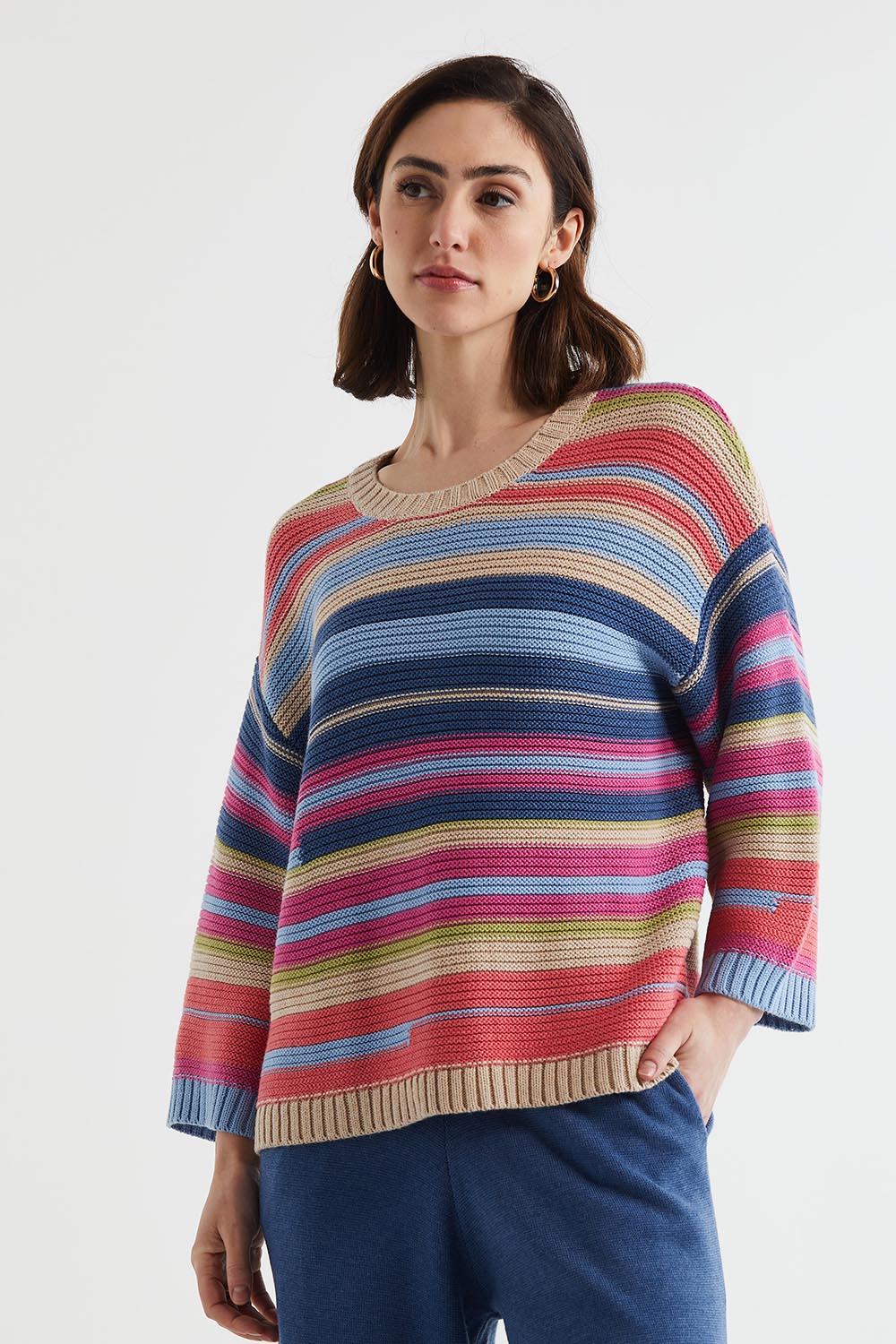 A model wearing the Multi Stripe Cotton Blend Jumper in colour Oat, from the front, cropped image