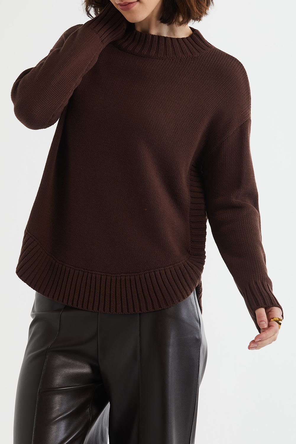 A model wearing the Cotton Mock Turtle in colour Chocolate, from the front, cropped image
