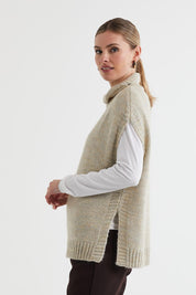 A model wearing the Lofty Tunic in colour Oat, from the back