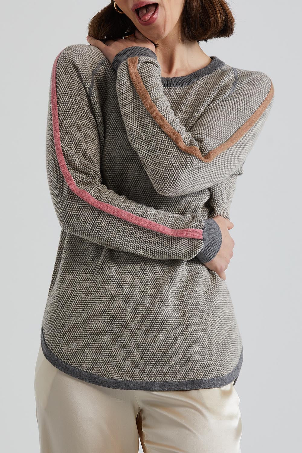 A model wearing the Waffle Lambswool Crew in colour Marl (Grey), from the front, cropped image