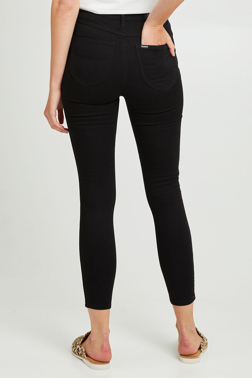 Model Madeline wearing size 8 of the Hi Rider Jean in colour Exblack (Black), from the back