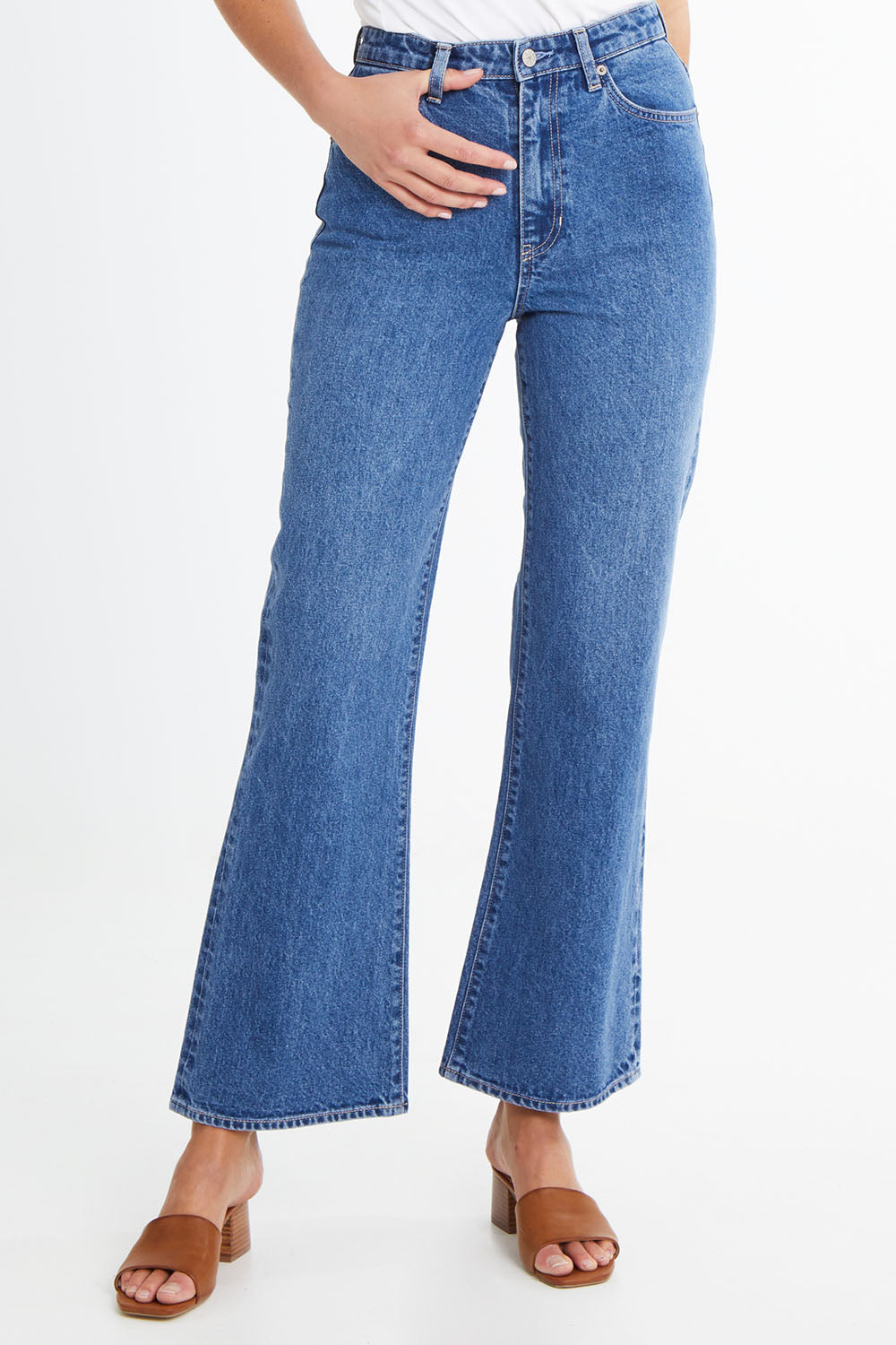 Model Madeline wearing size 10 of the Hi Flare in colour Goodvibes (Blue), from the front, cropped image