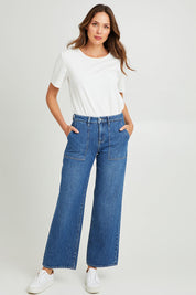 Model Madeline wearing size 10 of the Mid Vintage Wide Leg in colour Indigo (Blue), from the front, showing the whole outfit