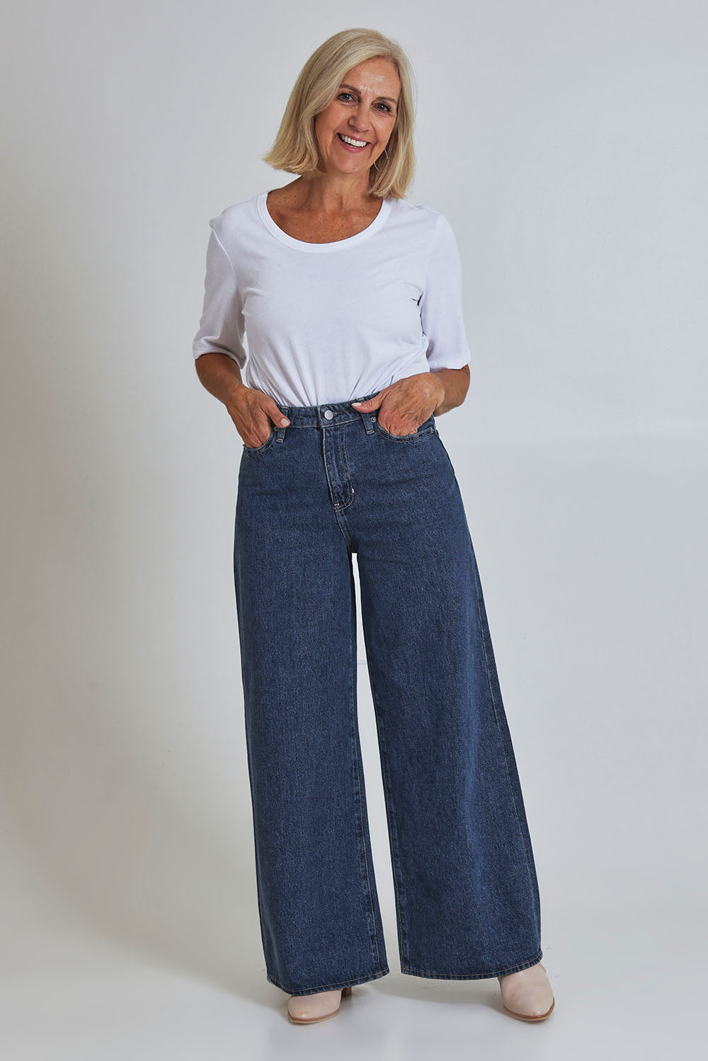 Model Sandy wearing size 10 of the Riders Mid Ain colourLine Wide Leg Jean - Bluehorizo (Blue), from the front, showing the whole outfit