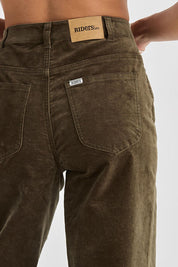 A model wearing the Riders Hi Wide Cord Straigh Leg Pant in colour Deepolive (Green), from the back