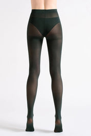 A model wearing the Suede Matte 50 Stocking in colour Deeppine (Green), from the back
