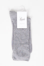 A model wearing size OneSize of the Rib Midi Sock in colour Greymarle (Grey), from the front, showing the whole outfit