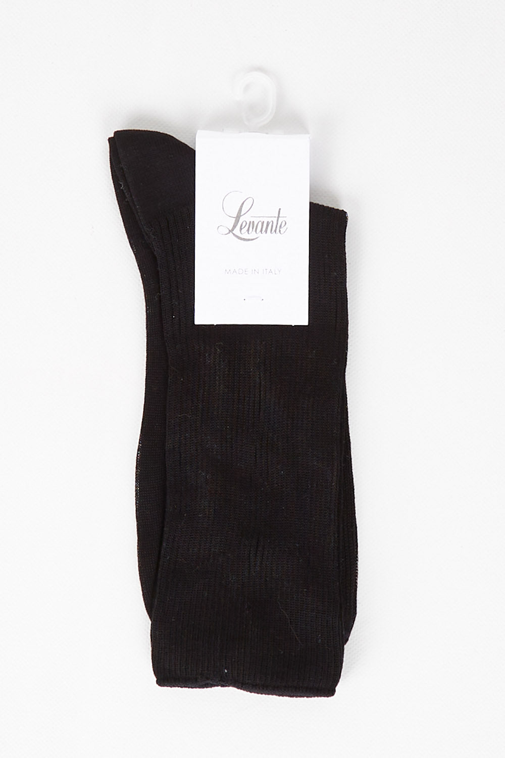 A model wearing size OneSize of the Rib Midi Sock in colour Nero (Black), from the front, showing the whole outfit