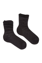 Product shot of the Rib Midi Sock in colour Nero (Black), from the front