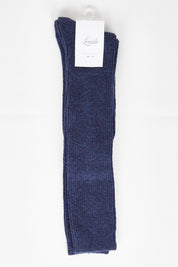 A model wearing size OneSize of the Slouchy Sock in colour Ink (Blue), from the front, showing the whole outfit