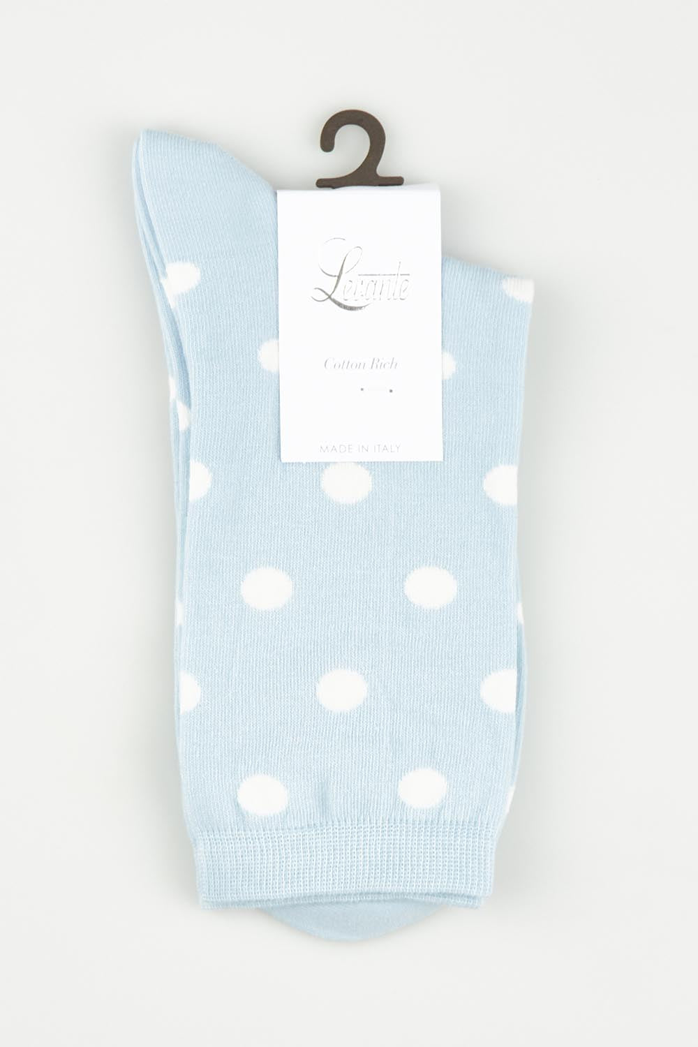 A model wearing size OneSize of the Gigi Spot Sock in colour Capri (Blue), from the front, showing the whole outfit