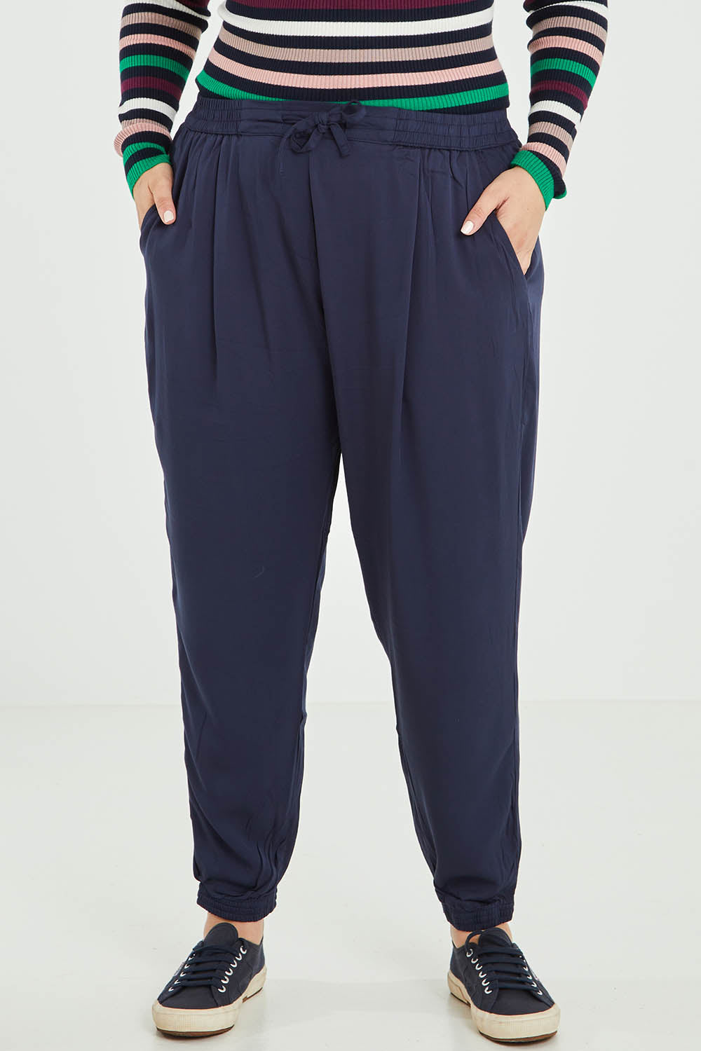 Model Jess wearing size 16 of the Tetbury Trouser in colour Navy (Blue), from the front, cropped image