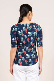 A model wearing the Rockpool Top in colour Navy (Blue), from the back