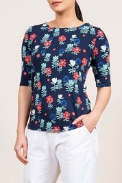 A model wearing the Rockpool Top in colour Navy (Blue), from the front, cropped image