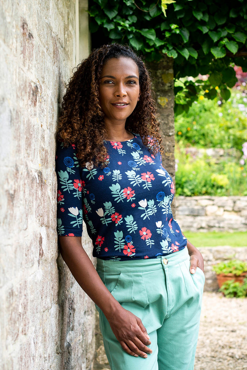 A model wearing the Rockpool Top in colour Navy (Blue), from the front, showing the whole outfit