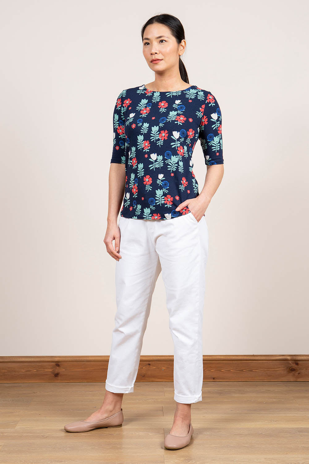 A model wearing the Rockpool Top in colour Navy (Blue), from the front, showing the whole outfit