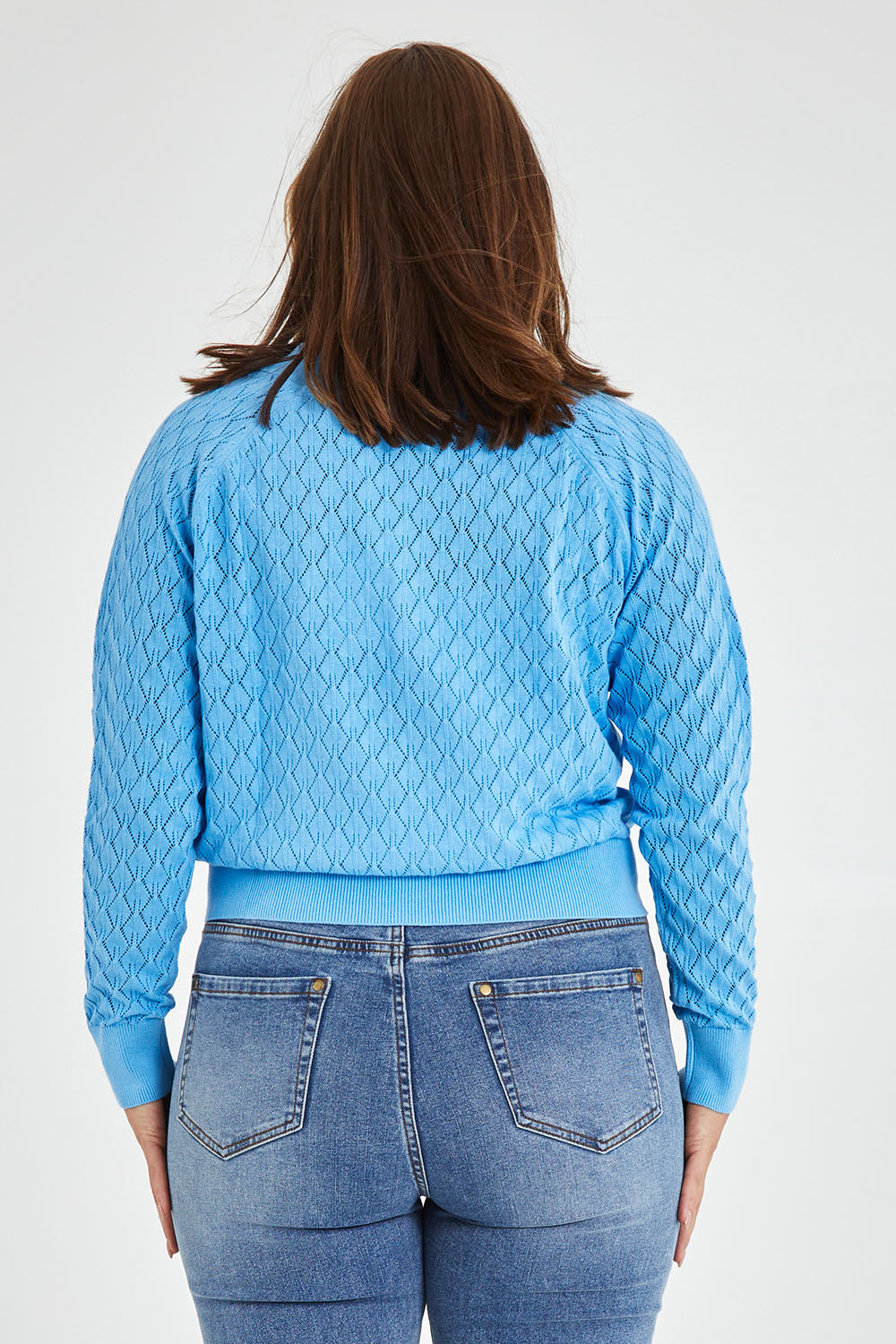 Model Monique wearing size 14 of the Eclipse Cardi in colour Skyblue (Blue), from the back