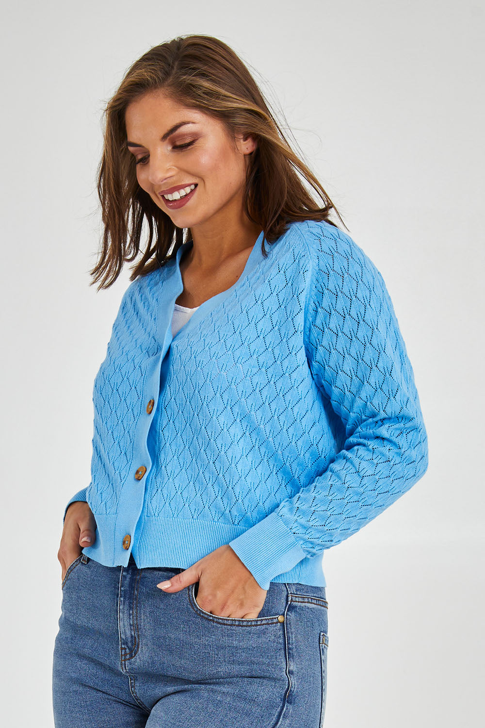 Model Monique wearing size 14 of the Eclipse Cardi in colour Skyblue (Blue), from the front, cropped image