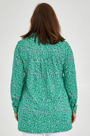 Model Monique wearing size 14 of the Grange Tunic in colour Bgreen (Green), from the back