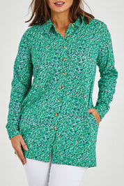 Model Monique wearing size 14 of the Grange Tunic in colour Bgreen (Green), from the front, cropped image