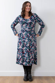 A model wearing the Jersey Swing Dress in colour Folkfloral (Blue), from the front, showing the whole outfit