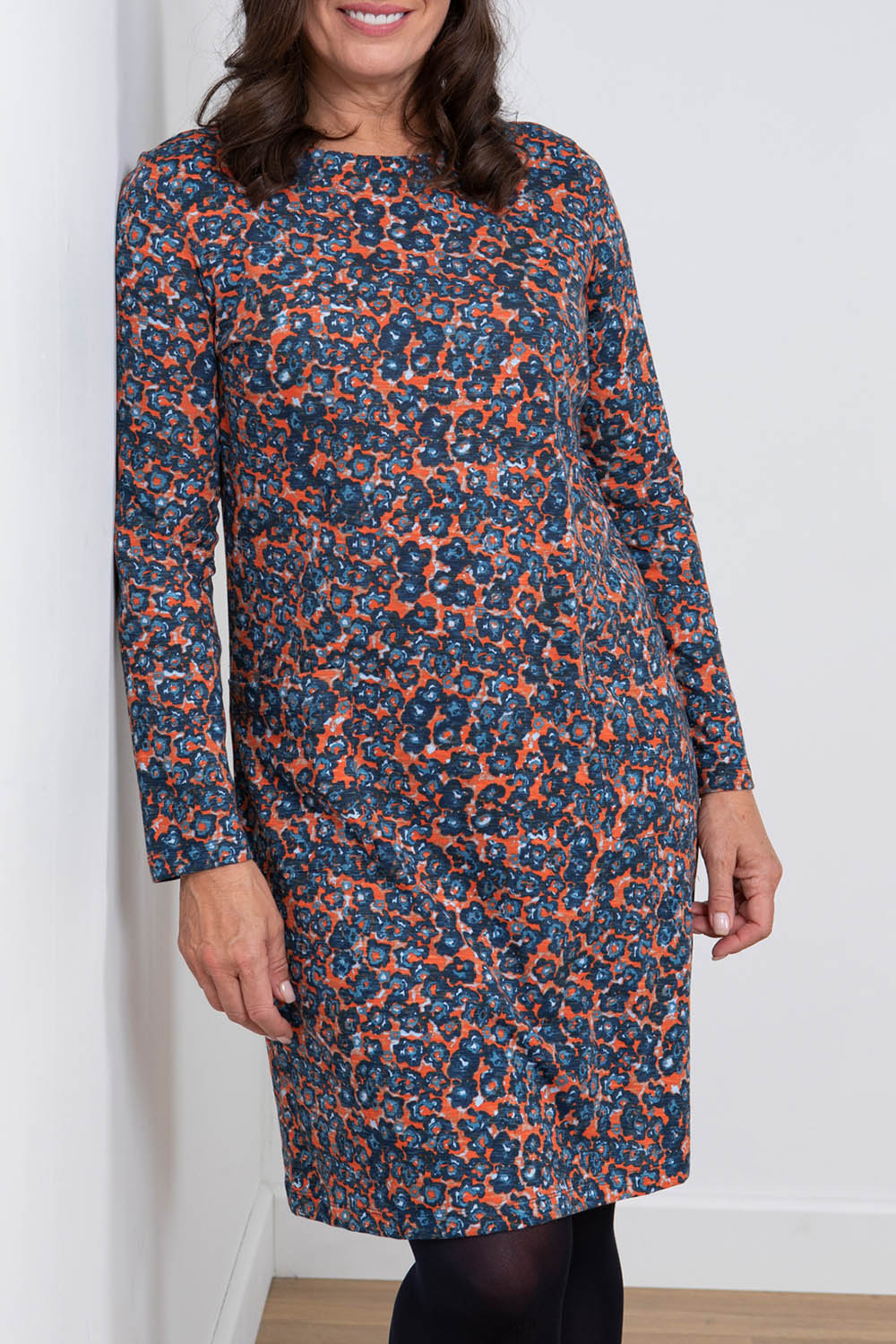 A model wearing the Maisemore Dress in colour Floret (Blue), from the front, cropped image