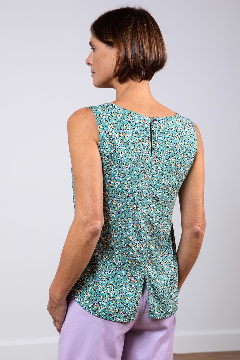 A model wearing the Sea Breeze Tank in colour Seagreen (Green), from the back