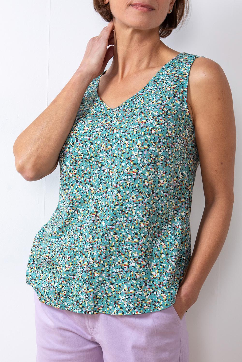 A model wearing the Sea Breeze Tank in colour Seagreen (Green), from the front, cropped image