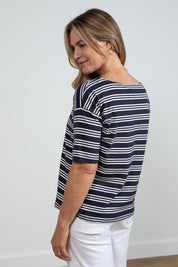 A model wearing the Blockley Top in colour Navy (Blue), from the back
