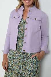 A model wearing the Clovelly Jacket in colour Lavender (Purple), from the front, cropped image