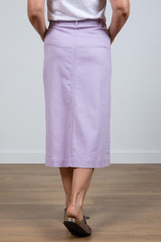 A model wearing the Rosanna Skirt in colour Lavender (Purple), from the back