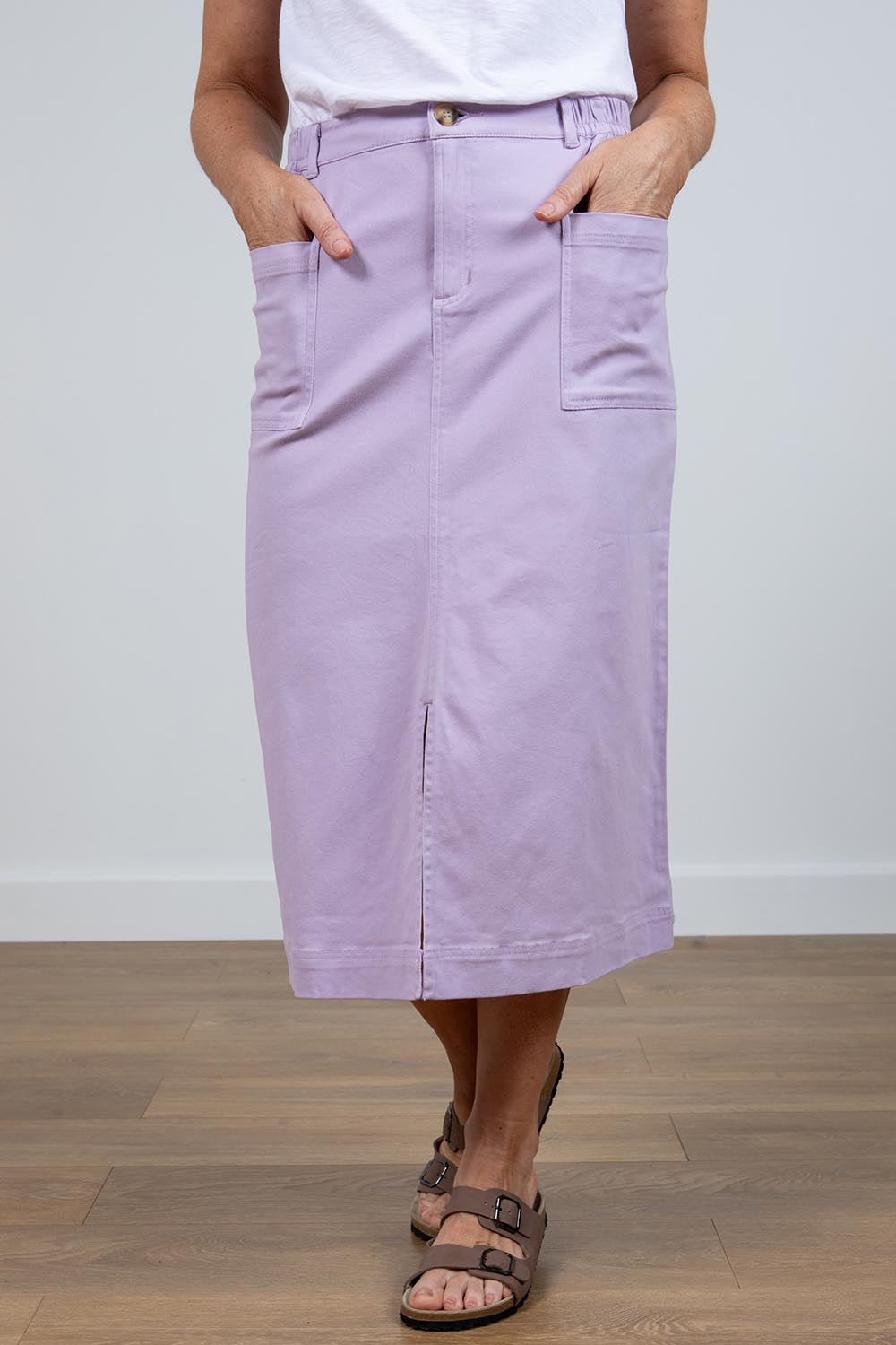 A model wearing the Rosanna Skirt in colour Lavender (Purple), from the front, cropped image