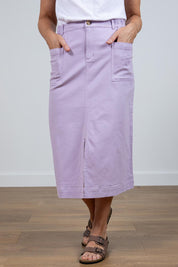 A model wearing the Rosanna Skirt in colour Lavender (Purple), from the front, cropped image
