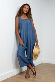 A model wearing the Edith Jumpsuit in colour Tencel (Blue), from the front, showing the whole outfit
