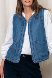 A model wearing the Deco Quilted Tencel Gilet in colour Blue (Blue), from the front, cropped image