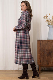 A model wearing the Ellington Check Dress in colour Mulberry (Red), from the back