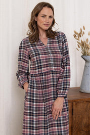 A model wearing the Ellington Check Dress in colour Mulberry (Red), from the front, cropped image