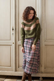 A model wearing the Alice Check Skirt in colour Mulberry (Red), from the front, showing the whole outfit