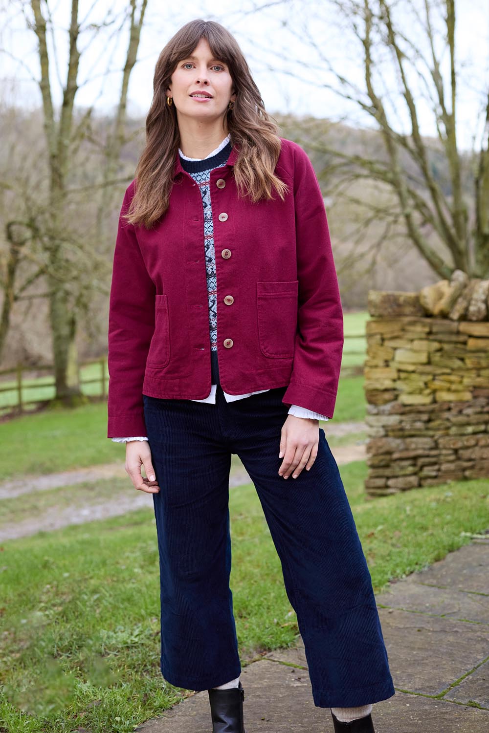 A model wearing the Isla Crop Cotton Cord Trouser in colour Navy (Blue), from the front, showing the whole outfit