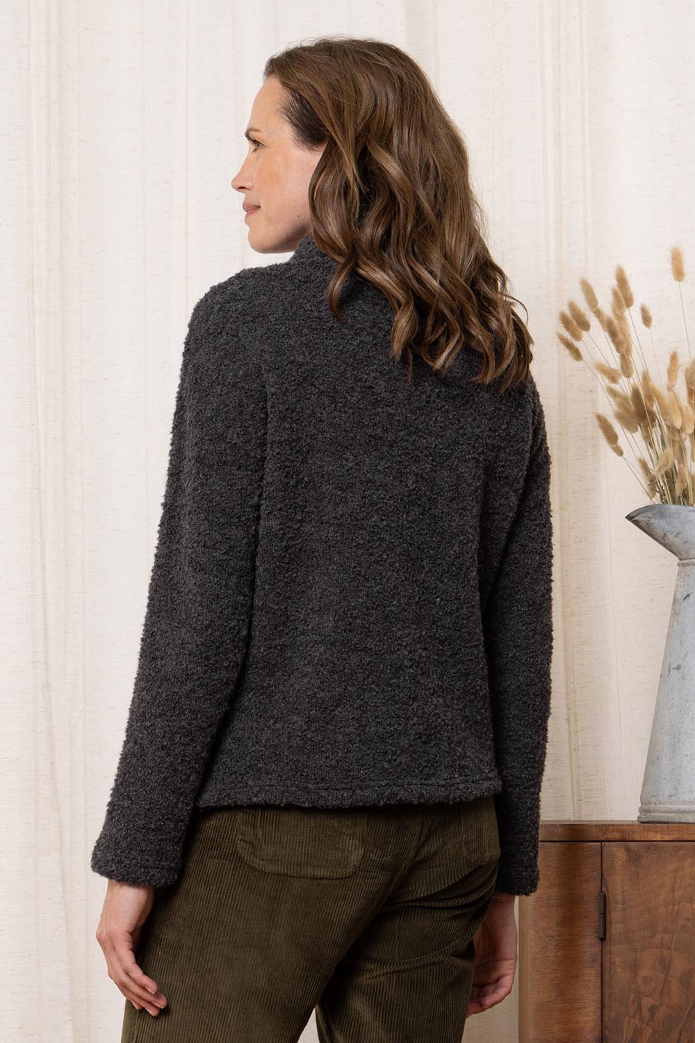 A model wearing the May Wool Blend Jumper in colour Charcoal (Black), from the back