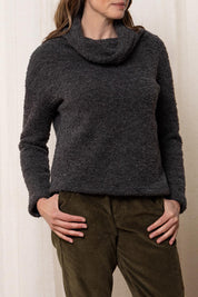 A model wearing the May Wool Blend Jumper in colour Charcoal (Black), from the front, cropped image