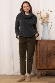 A model wearing the May Wool Blend Jumper in colour Charcoal (Black), from the front, showing the whole outfit