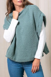 A model wearing the Tabitha Button Wool Blend Poncho in colour Duckegg (Blue), from the front, cropped image