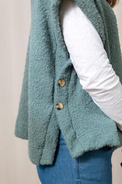 A model wearing the Tabitha Button Wool Blend Poncho in colour Duckegg (Blue), from the front, cropped image