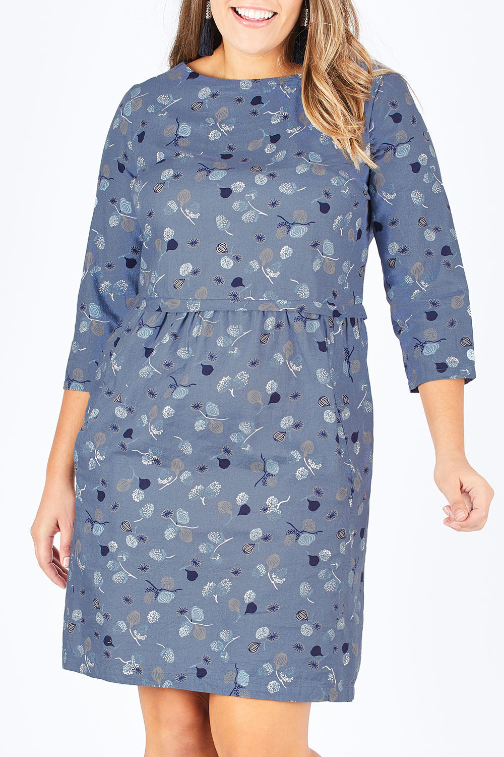 Model Natalia wearing size 14 of the Keep It Simple Dress in colour SteelBlue (Blue), from the front, cropped image