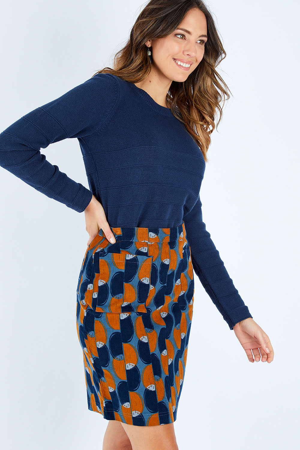 Model Madeline wearing size 10 of the Annabelle Cord Skirt in colour Blueginger (Blue), from the front, cropped image