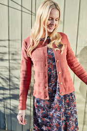 A model wearing the Gabriella Knit Cardi in colour Softbrick, from the front, showing the whole outfit