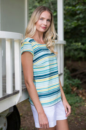 A model wearing the Sun And Shade Top in colour Tealstrip (Green), from the front, showing the whole outfit
