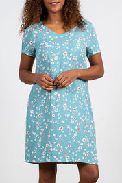 A model wearing the Seascape Dress in colour Seafoam (Blue), from the front, cropped image
